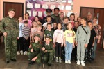 Казаки  Свято-Александровской станицы и юные казачата, учащиеся школы с.  В. Телелюй в гостях у ребят лагеря "Дружный"